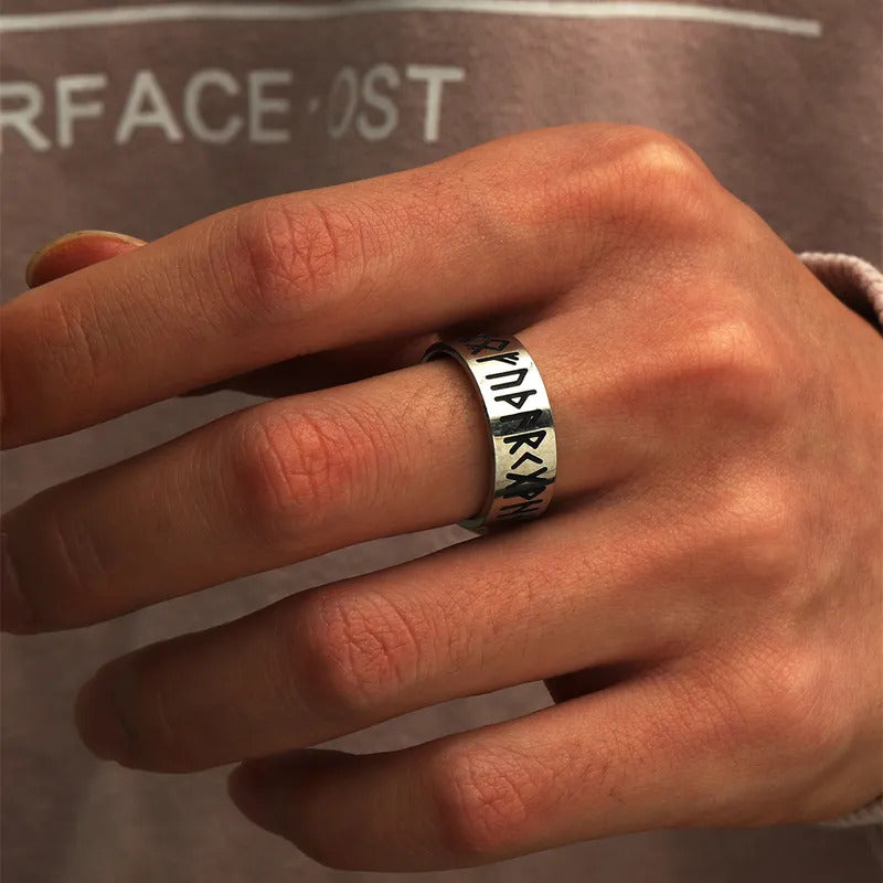 LuminaryLA Men's Titanium Steel Retro Carved Pattern Ring reflecting a timeless style when worn on elegant hand.